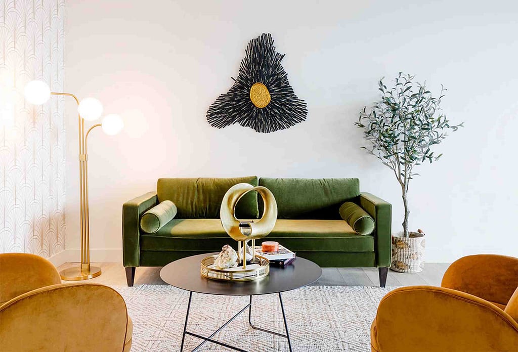 Velvet sofas with black round table